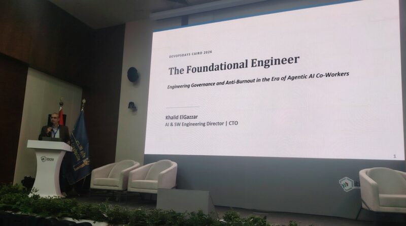 DevOpsDays Cairo 2026: speaker at the podium and the slide The Foundational Engineer, engineering governance and anti-burnout in the era of agentic AI co-workers